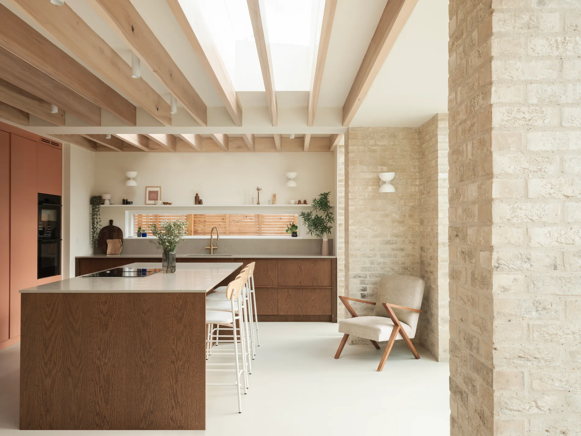 Minimal Skymax rooflight bringing daylight into a pale contemporary kitchen