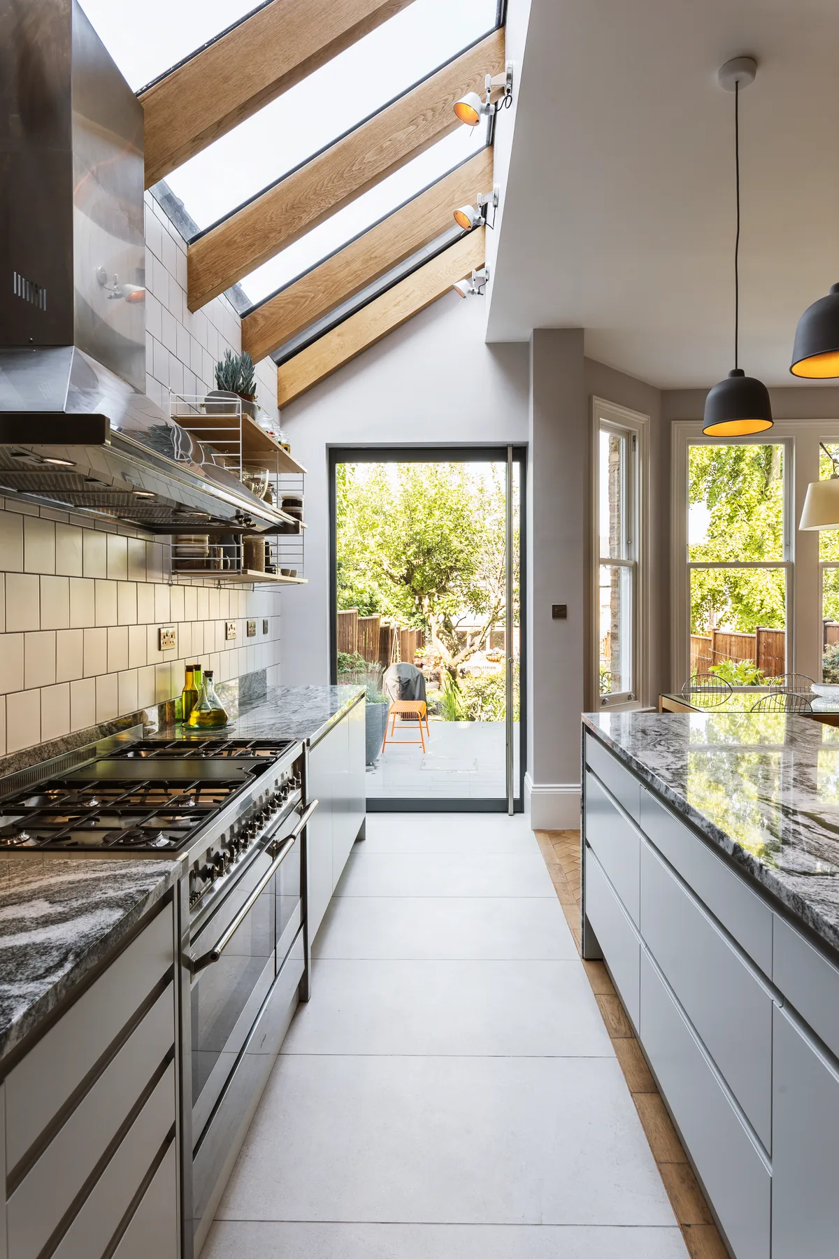 Galley kitchen with lean-to roof glazing running along the wall