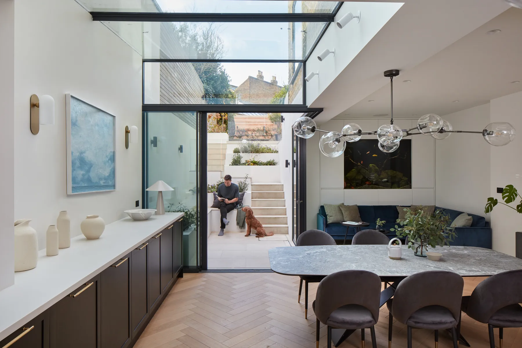 Kitchen and dining room with up-and-over glazing leading toward the garden