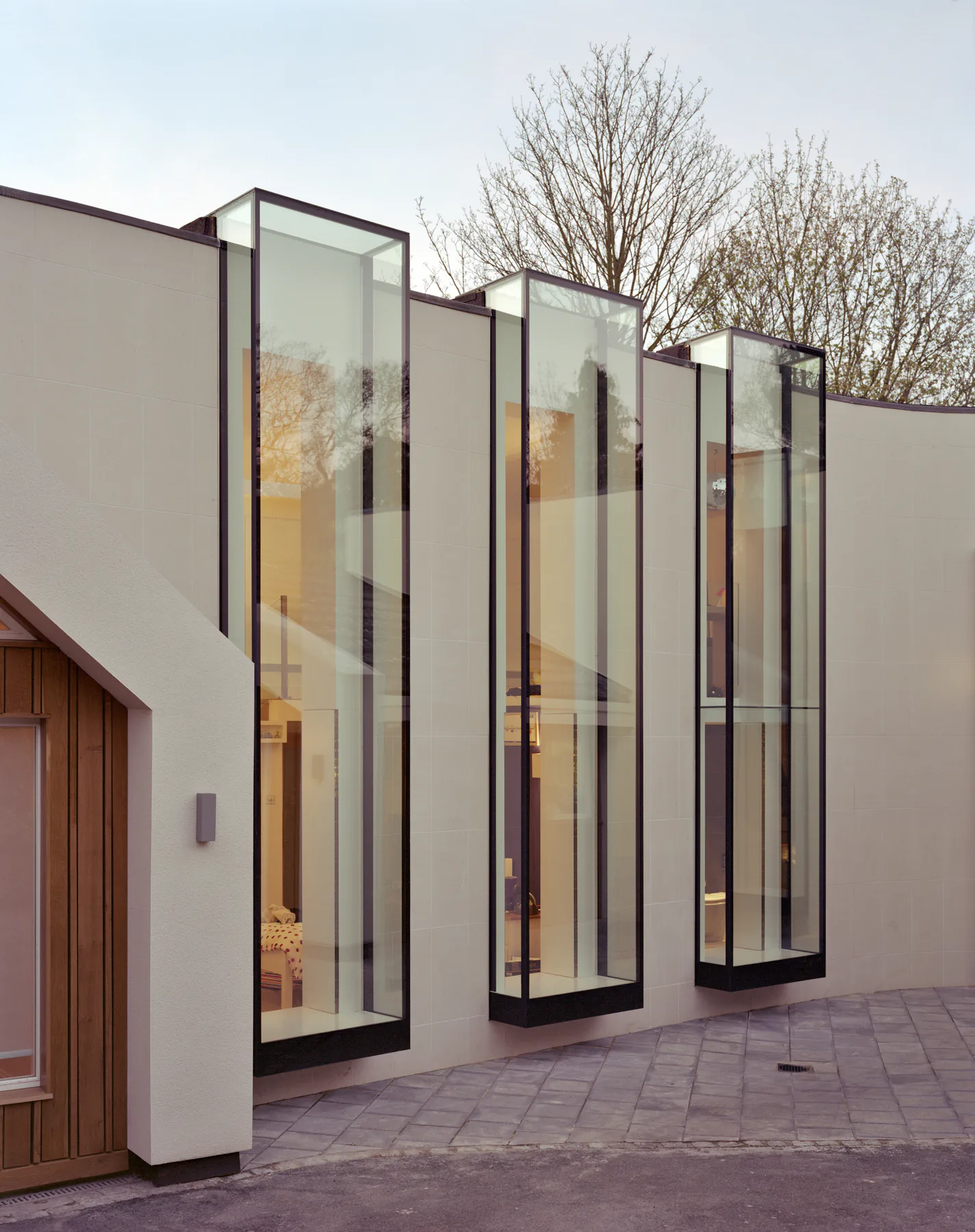 Projecting aluminium oriel bay windows on a contemporary residential facade